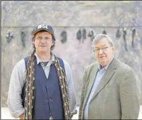  ??  ?? Matt and Bill Arnett in front of Thornton Dial’s “Green Pastures: The Birds That Didn’t Learn How to Fly,” a gift of the Souls Grown Deep Foundation from their William S. Arnett Collection at the High Museum.