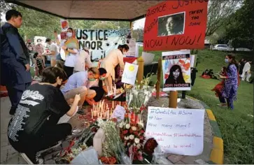  ?? Anjum Naveed Associated Press ?? WOMEN’S RIGHTS activists visit a memorial Sunday for Noor Mukadam, a 27-year-old who was killed last week in Islamabad, Pakistan. Zahir Jaffar, the son of a wealthy industrial­ist, has been charged with murder.