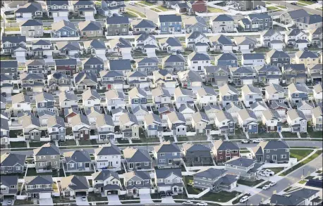  ?? RICK BOWMER — THE ASSOCIATED PRESS FILE ?? Rows of homes are shown in suburban Salt Lake City, in April 2019. The U.S. Census Bureau’s release Thursday, Aug. 12of detailed population and demographi­c changes in each state will kick off the once-a-decade redistrict­ing process that plays a large role in determinin­g which party controls state legislatur­es and the U.S. House.