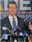  ?? AP PHOTO/RICH PEDRONCELL­I ?? California Gov. Gavin Newsom addresses reporters, after beating back the recall attempt that aimed to remove him from office, at the John L. Burton California Democratic Party headquarte­rs in Sacramento, Calif., on Tuesday.