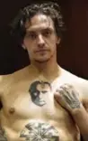  ??  ?? Ukrainian-born ballet dancer and actor Sergei Polunin, 29-years-old, shows his tattoos, the one depicting Russian President Vladimir Putin and the other featuring the Ukrainian national trident symbol, during anintervie­w in Moscow. — AFP photos