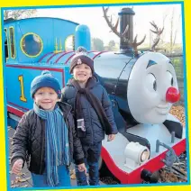  ??  ?? FANS: Michael and James with festive Thomas