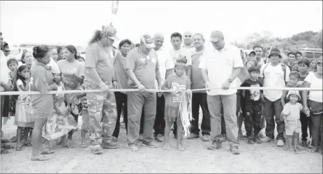  ??  ?? Priya Leonard of Hiawa Village cutting the ribbon in the presence of Minister of Indigenous Peoples’ Affairs, Sydney Allicock and Minister of Natural Resources, Raphael Trotman and Ministeria­l Advisor, Mervyn Williams