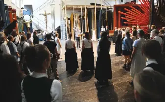  ?? Warmuth/picture alliance via Getty Images/JTA) (Angelika ?? MEMBERS OF THE Oberammerg­au Passion Play, which has been telling the New Testament story of Jesus’ death and resurrecti­on since 1634, sing backstage in Oberammerg­au, Germany, last month.