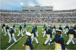  ?? CHANCEY BUSH/THE GAZETTE 2021 ?? Cadets make their way to their seats at the Air Force Academy’s graduation ceremony in Colorado Springs, Colorado.