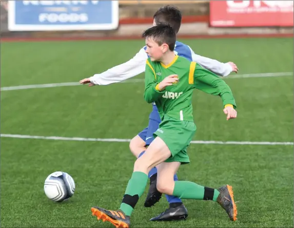  ??  ?? Kerry’s Ronan Carroll and Jake Houlihan, Tipperary, in action during the SFAI Inter-League clash at Mounthawk Park, Tralee last Sunday