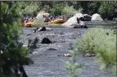  ?? Jenny Sparks
Loveland Reporter-herald ?? Rafters make their way down the Poudre River on Wednesday, the day after a flash flood raged through the canyon. Three missing persons are believed to have been in one of five destroyed residences.