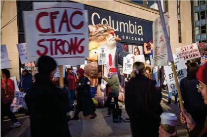  ?? ?? Adjunct professors and Columbia College faculty union members walk the picket line outside Columbia College Chicago. Photograph: Michael Jarecki via Columbia College Faculty Union