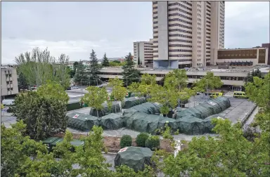  ??  ?? Spanish military tents sit ready Friday at the Gomez Ulla military hospital in Madrid four months after similar structures for an overflow of coronaviru­s patients were taken down. (AP/Manu Fernandez)