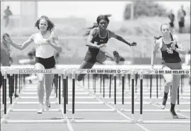  ?? Steve Galluzzo For The Times ?? UPLAND SENIOR Jada Hicks, center, races to victory in the 100-meter hurdles at El Camino College. Her time of 13.54 seconds tied a personal best.