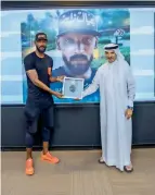  ??  ?? Nicolas Anelka receives the award from Saeed Hareb.— Supplied photo