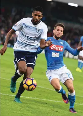  ??  ?? Napoli's Dries Martens, right, and Lazio's Wallace vie for the ball during the Italian Serie A soccer match between Napoli and Lazio