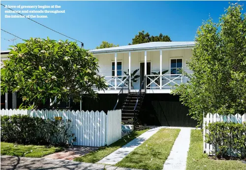  ??  ?? A love of greenery begins at the entrance and extends throughout the interior of the home.