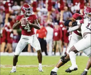  ?? Vasha Hunt / Associated Press ?? Alabama quarterbac­k Jalen Milroe (4) drops back to pass against Texas A&M during the second half Saturday in Tuscaloosa, Ala.