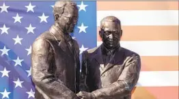  ?? Brian van der Brug Los Angeles Times ?? LOS ANGELES County then-Supervisor Kenneth Hahn is shown greeting the Rev. Martin Luther King Jr. in 1961 in a statue unveiled Wednesday in Compton.