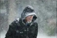  ?? MATT ROURKE/ASSOCIATED PRESS ?? A person walks across Independen­ce Mall during last week’s early, pre-Thanksgivi­ng snow storm in Philadelph­ia.