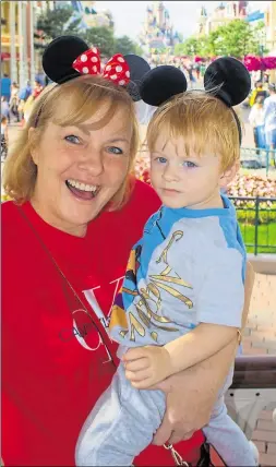  ??  ?? Breast cancer survivor Maxine Wilson is pictured with her grandson Max at Disneyland