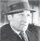  ?? [AP FILE PHOTO] ?? Writer Mickey Spillane appears in character from the film “The Girl Hunters” in New York in this July 1963 photo.