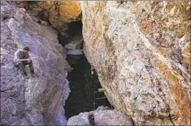  ?? Gina Ferazzi Los Angeles Times ?? BIOLOGIST Daniel Bailey Gaines at Devils Hole in Nevada in 2014. The pool, the only habitat of its namesake pupfish, is a part of Death Valley National Park.