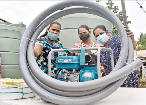  ?? Picture: BALJEET SINGH ?? Farmers Priya Prakash (left), Charryl Lata and Keshwari Dayal with the irrigation kit after the handover ceremony at Legalega Research Station in Nadi.