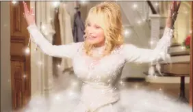  ?? Associated Press ?? Dolly Parton in a scene from “Dolly Parton’s Christmas on the Square” now streaming on Netflix.