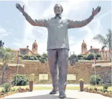  ??  ?? A 9m bronze statue of Nelson Mandela is at the Union Buildings in Pretoria.