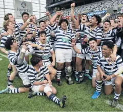  ?? PHOTO: GERARD O’BRIEN ?? With the spoils . . . The Otago Boys’ High School first XV celebrates winning the Otago Premier Schools rugby final at Forsyth Barr Stadium in Dunedin on Saturday.