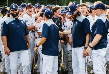  ?? JAMES BEAVER — FOR MEDIANEWS GROUP ?? The La Salle coaching staff celebrates with players after winning a PIAA-6A state semifinal game 2-0over North Penn.