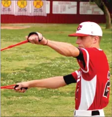  ?? MARK HUMPHREY ENTERPRISE-LEADER ?? Farmington starter Keaton Austin stretches his arms in preparatio­n for taking the mound against Harrison. Austin topped Farmington with 57.2 innings pitched in 11 games with 76 strikeouts and a 3.035 ERA as a senior.