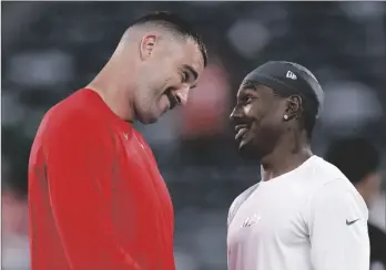  ?? AP PHOTO/ADAM HUNGER ?? Kansas City Chiefs tight end Travis Kelce (left) talks with New York Jets wide receiver Mecole Hardman Jr. before playing in an NFL football game, on Oct. 1 in East Rutherford, N.J.