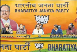  ?? HT PHOTO ?? BJP leaders announce names of candidates for the Uttarakhan­d polls in Delhi on Thursday.