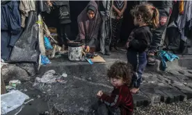  ?? Photograph: Anadolu/Getty Images ?? Palestinia­n families displaced from their homes make preparatio­ns for the iftar dinner in temporary tents in Rafah on Thursday.