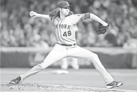  ?? JERRY LAI, USA TODAY SPORTS ?? Mets starting pitcher Jacob deGrom shut down the Cubs in Game 3, allowing two runs on four hits in seven innings.