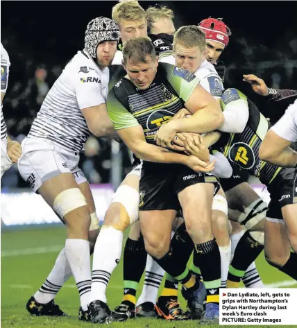  ??  ?? > Dan Lydiate, left, gets to grips with Northampto­n’s Dylan Hartley during last week’s Euro clash PICTURE: Getty Images