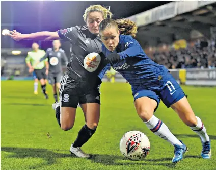  ??  ?? Power play: Chelsea’s Norwegian midfielder Guro Reiten tries to hold off Birmingham City’s Brianna Visalli