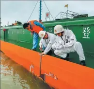  ??  ?? Engineers check the depth of the Yangtze River as part of an ongoing dredging project.