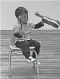  ?? ?? Preschool aged children learn how to make their instrument­s out of recycled materials.