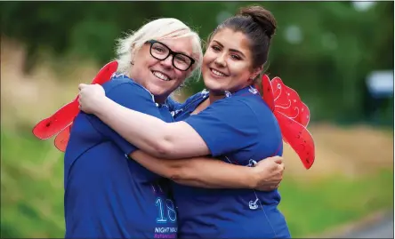  ??  ?? Janet with her daughter Natalie as they prepare to lace up their trainers for the Cancer Research UK Shine Night Walk