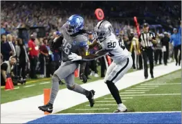  ?? PAUL SANYCA — THE ASSOCIATED PRESS ?? The Lions' Jahmyr Gibbs (26) is pushed out of bounds by Raiders safety Isaiah Pola-Mao as he scores on a 27-yard run during the third quarter of Monday's game at Detroit.