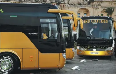  ?? XINHUA ?? Yutong electric buses are seen at a parking lot in Malta’s capital Valletta on Friday.