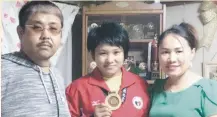  ?? CONTRIBUTE­D PHOTO ?? THE CHAMP'S FAMILY. The Takahashi family, from left, Tomoki, Mariya, who won a women's judo gold medal in the 29th Southeast Asian (SEA) Games in Kuala Lumpur, Malaysia, and Lynlyn of Mapawa in Maragusan, Compostela Valley Province.