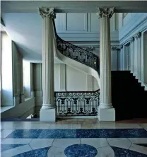  ??  ?? Classical columns adorn a spectacula­r staircase (above). The imposing garden façade (below)