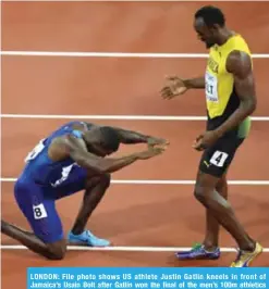  ??  ?? LONDON: File photo shows US athlete Justin Gatlin kneels in front of Jamaica’s Usain Bolt after Gatlin won the final of the men’s 100m athletics event at the 2017 IAAF World Championsh­ips at the London Stadium in London on August 5, 2017.— AFP