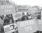  ??  ?? CASA de Maryland, an immigratio­n advocacy group, rallies in Washington on Monday, reacting to the removal of Temporary Protected Status for people from El Salvador. AP