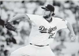  ?? Chris Carlson / Associated Press ?? Clayton Kershaw had only one runner reach base, on an error by Hanley Ramirez, on Wednesday night.