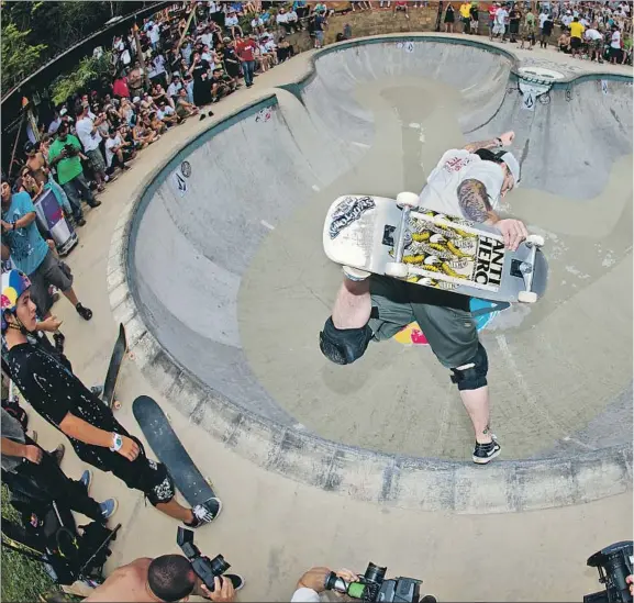  ??  ?? JEFF GROSSO DOES a backside boneless move in Pedro Barros’ Backyard Skate Generation Backyard Bowl contest in Florianopo­lis, Brazil, in 2010. “He was the gatekeeper t