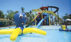  ?? facebook/IslandCove­HotelandLe­isurePark ?? Oceania Swim and Splash Park features giant slides and inflatable­s, as well as a kid-friendly splash zone