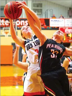  ?? Photograph by Randy Moll ?? Sophomore Lady Blackhawk Hollyn Davis tries to block Gravette’s Kyrstin Branscum as she attempts a shot below the basket during the game between the two rivals in Lion Field House Friday, Jan. 20.