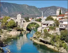  ?? Rick Steves’ Europe/CAMERON HEWITT ?? Mostar’s Old Bridge — a 21st-century reconstruc­tion of the 16th-century original — is traditiona­lly considered the point wheree East meets West.