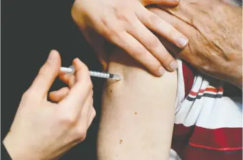  ?? GETTY IMAGES/FILES ?? A recent poll found that about one-quarter of those in B.C. who haven't yet received their COVID-19 vaccinatio­n are jealous of those who have.